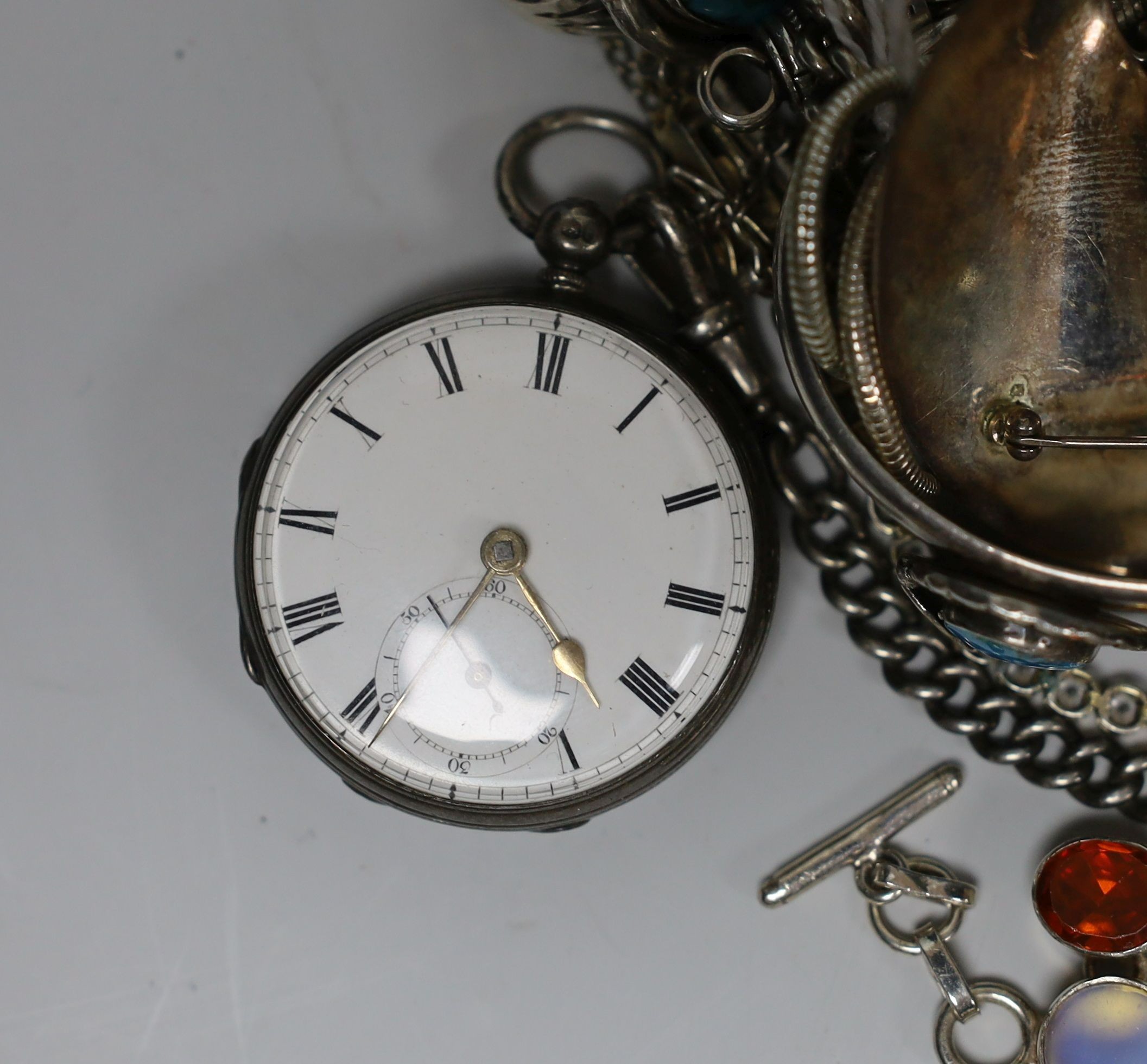 A quantity of assorted silver and white metal jewellery etc. including albert chain with pocket watch, bangles, bracelets, brooches, money clip and rings.